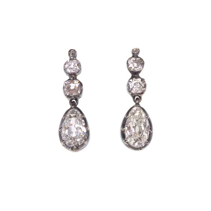Pair of pear shaped diamond pendant earrings